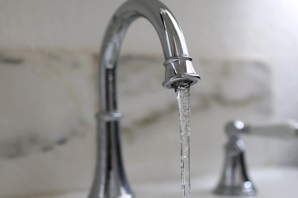 A stock image of a water faucet