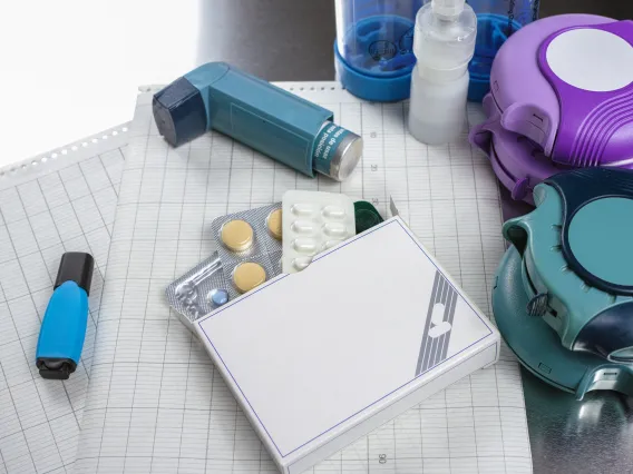 A stock image of an inhaler and other medicines