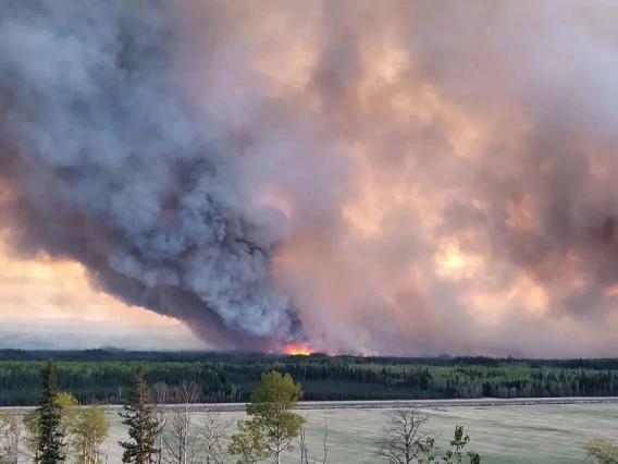 A stock image of a field on fire