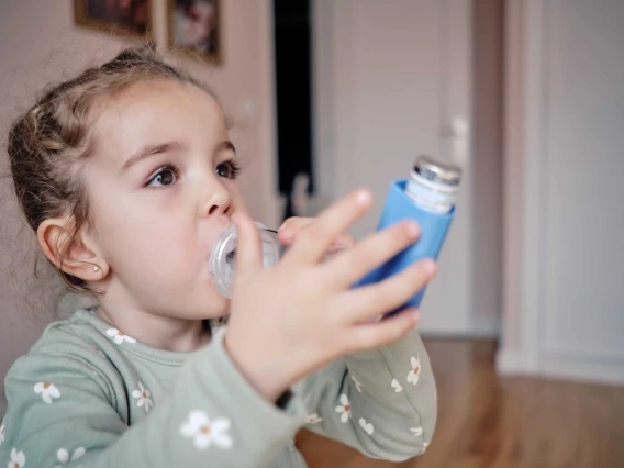 A stock image of a child with an ihaler