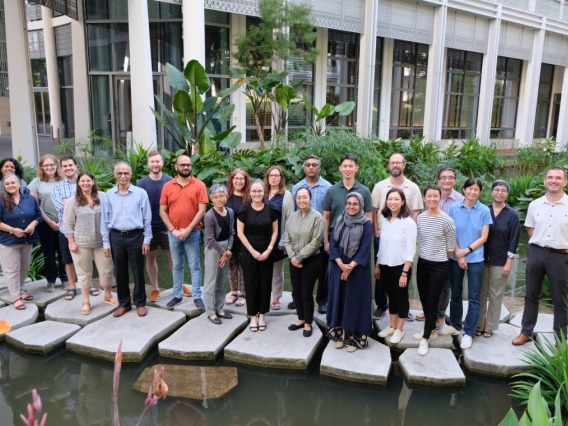 A picture of a group of researchers in a patio