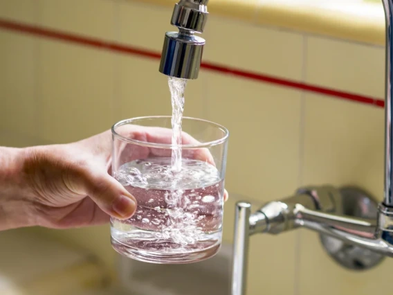 A glass being filled with water