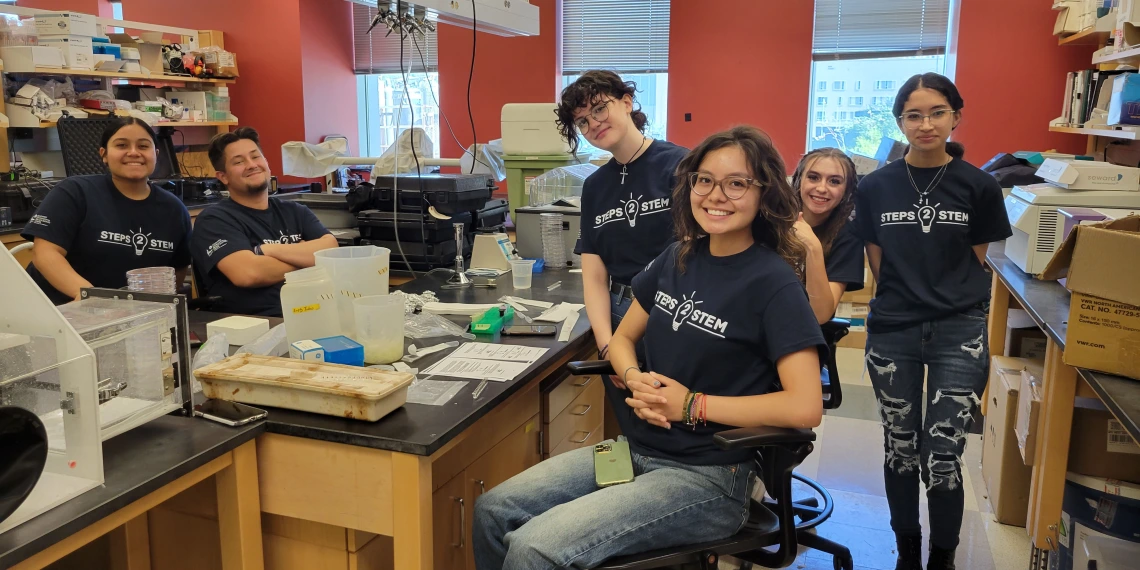 A picture of students in a lab. 