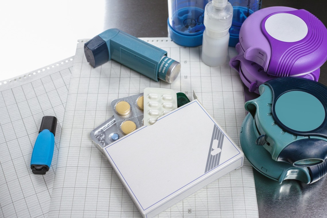 A stock image of an inhaler and other medicines