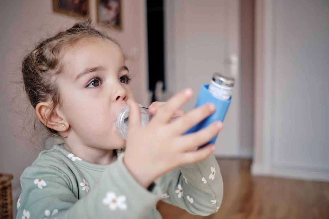 A stock image of a child with an ihaler