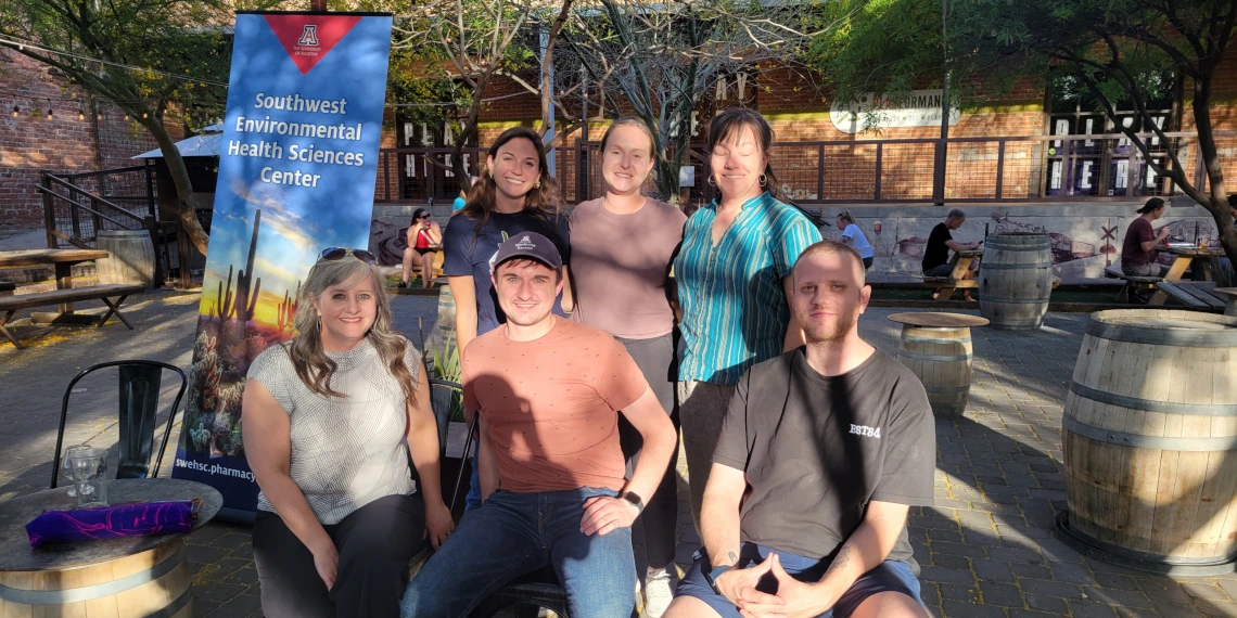 A photo of a group of researchers at a community event