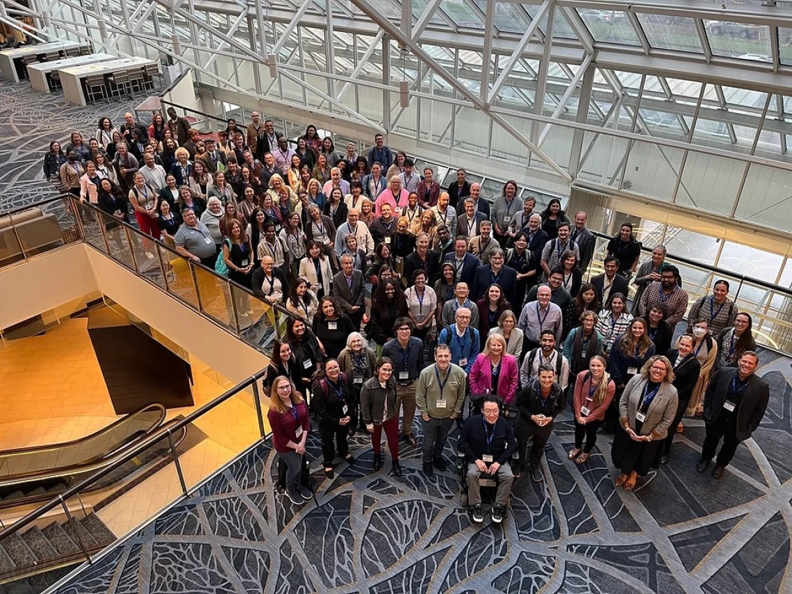 A picture of a group of researchers at a conference 