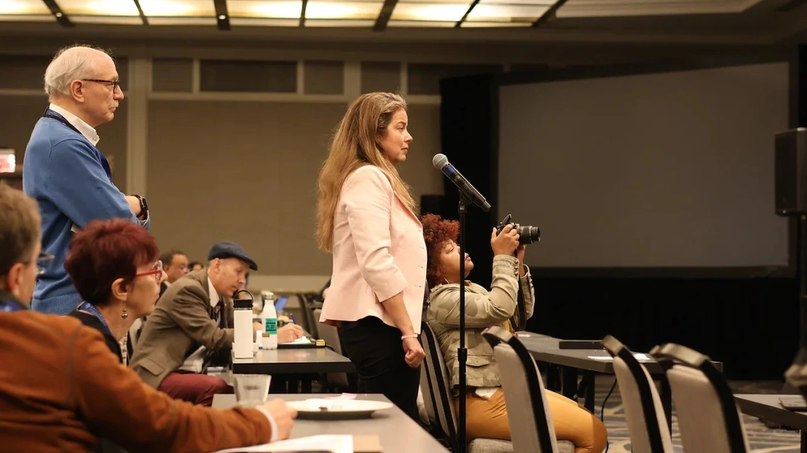 An image of Dr.Beamer speaking at a conference 