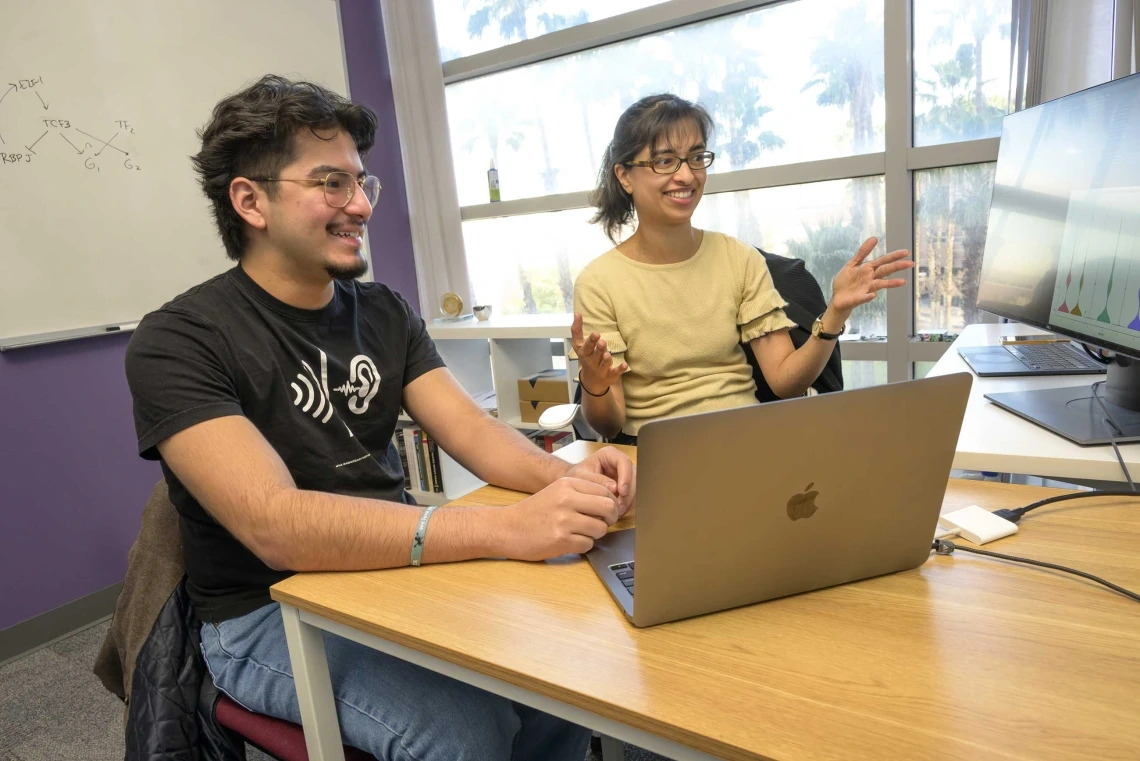 (From left) Waldo Guzman Barrientos is taking part in the Place-based Health Informatics Research Education program, with Megha Padi, PhD, an assistant professor at the University of Arizona College of Medicine – Tucson’s Department of Cellular and Molecular Medicine.