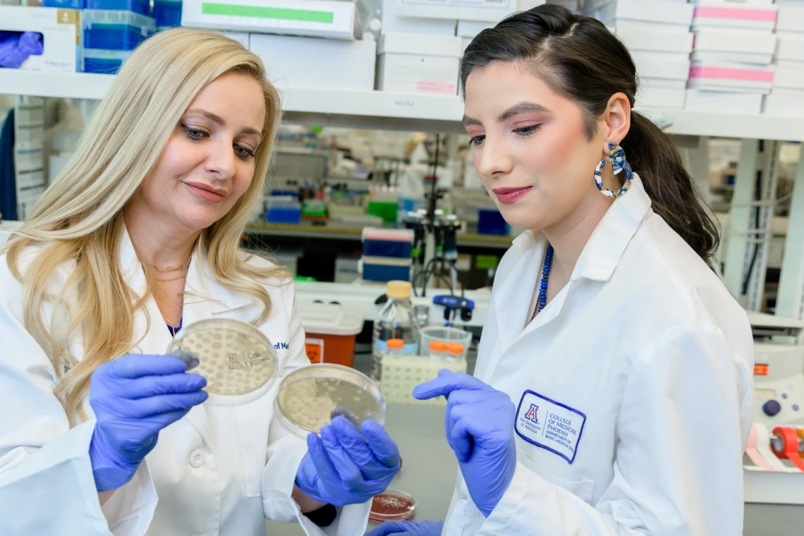 From left, Melissa Herbst-Kralovetz and Nicole Jimenez work in the Herbst-Kralovetz lab.