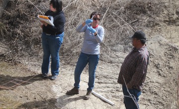 Dr. Beamer and others collecting samples for environmental testing