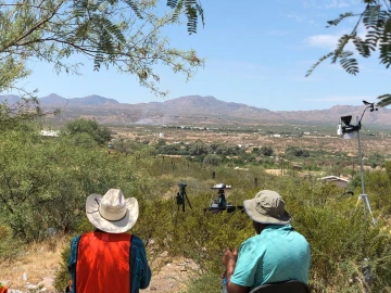 An image of researchers atop a mountain