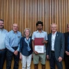 Image of Dr. Cherrington and people receiving awards