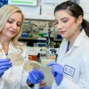 From left, Melissa Herbst-Kralovetz and Nicole Jimenez work in the Herbst-Kralovetz lab.