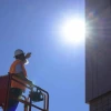 Image of a worker in the sun