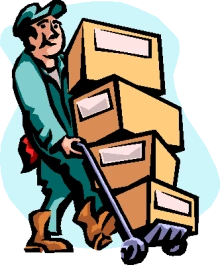 a workman with a hand truck (dolly) moves a stack of boxes