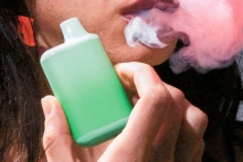 Image of a woman vaping