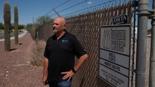 Tucson Water Director John Kmiec stands next to one of about 40 city wells that have been shut off because of PFAS contamination.