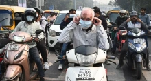 picture of people on mopeds in traffic