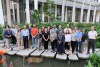 A picture of a group of researchers in a patio